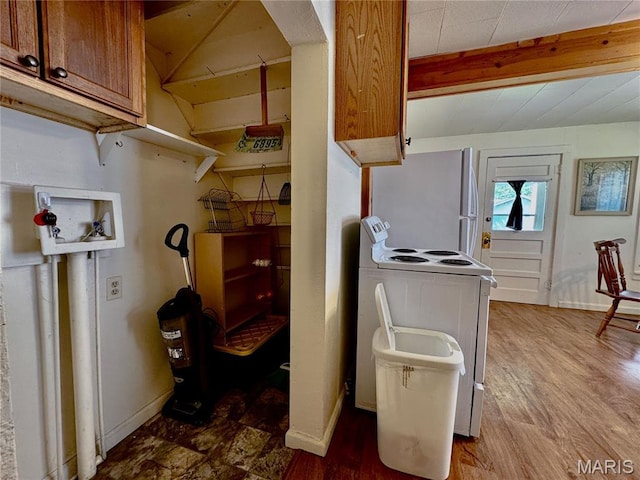 274 Cornelison St, Lebanon, MO 65536 - kitchen with white appliances, beam ceiling, brown cabinetry, and wood finished floors