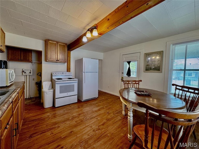 274 Cornelison St, Lebanon, MO 65536 - kitchen with white appliances, wood finished floors, brown cabinets, and a sink