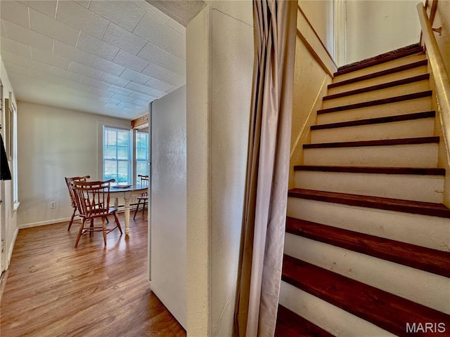 274 Cornelison St, Lebanon, MO 65536 - stairway featuring wood finished floors and a textured wall