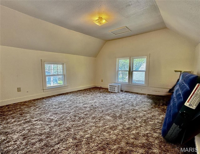 274 Cornelison St, Lebanon, MO 65536 - bonus room featuring vaulted ceiling, a textured ceiling, carpet flooring, baseboards, and an AC wall unit