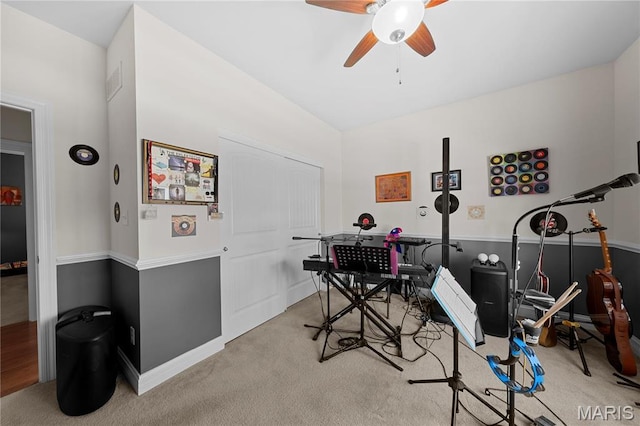 recreation room with ceiling fan, carpet, baseboards, and a desk