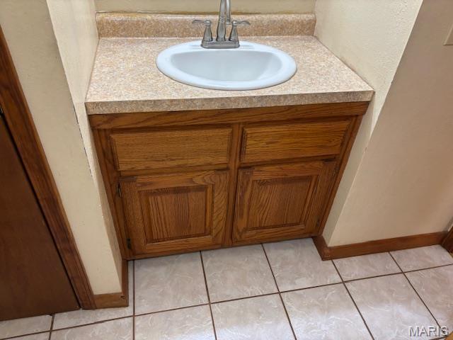 bathroom view of vanity and baseboards