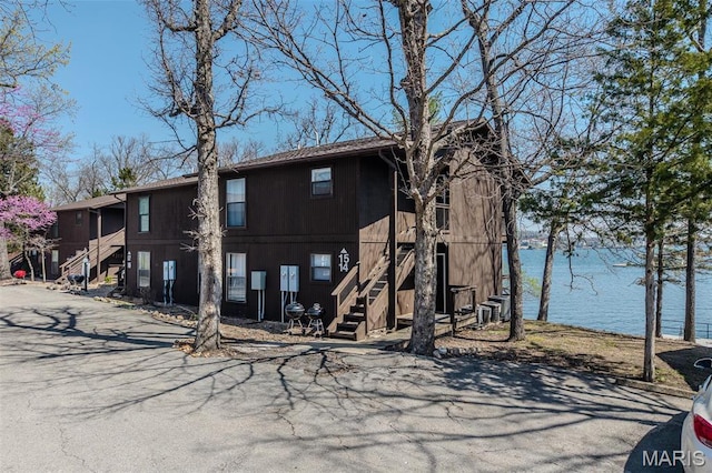 256 Lone Oak Unit 15, Sunrise Beach, MO 65079 - view of front of house with stairs and a water view