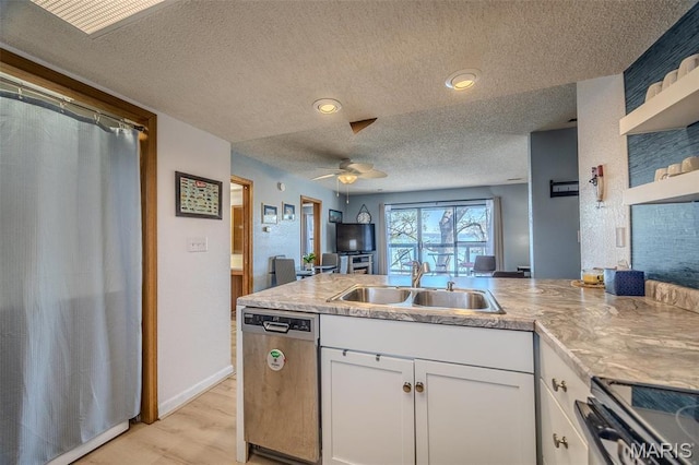 256 Lone Oak Unit 15, Sunrise Beach, MO 65079 - kitchen featuring stainless steel appliances, a sink, a textured ceiling, a peninsula, and open shelves
