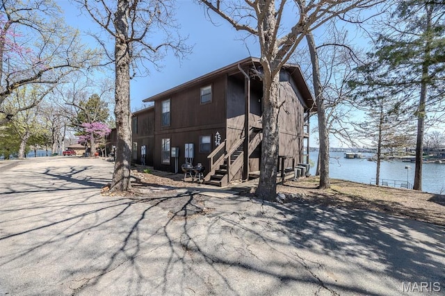 256 Lone Oak Unit 15, Sunrise Beach, MO 65079 - back of property featuring a water view and stairs