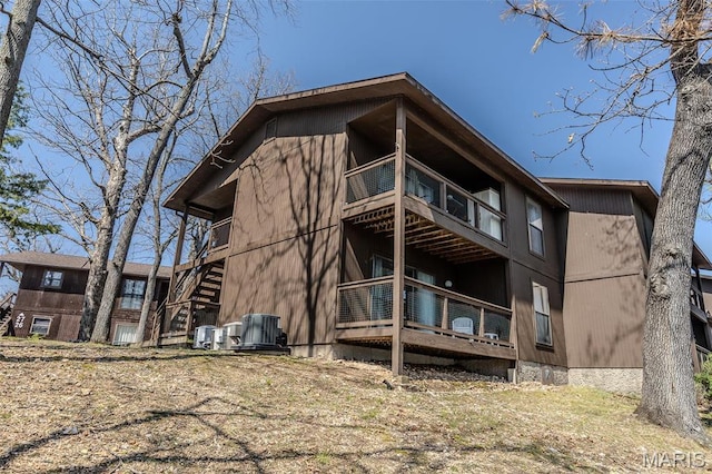 256 Lone Oak Unit 15, Sunrise Beach, MO 65079 - rear view of house featuring a balcony