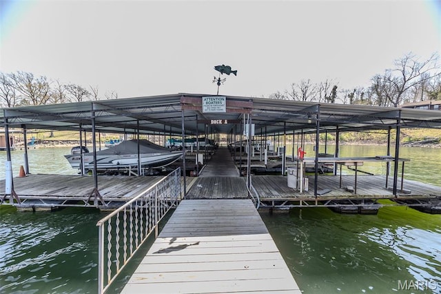 256 Lone Oak Unit 15, Sunrise Beach, MO 65079 - dock featuring boat lift and a water view