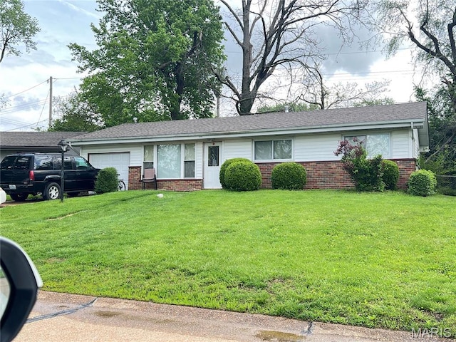 ranch-style house with an attached garage, brick siding, and a front yard