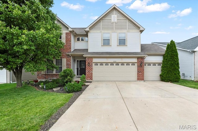 2226 Bay Tree Dr, Saint Peters, MO 63376 - view of front of home with brick siding, a front yard, concrete driveway, and an attached garage