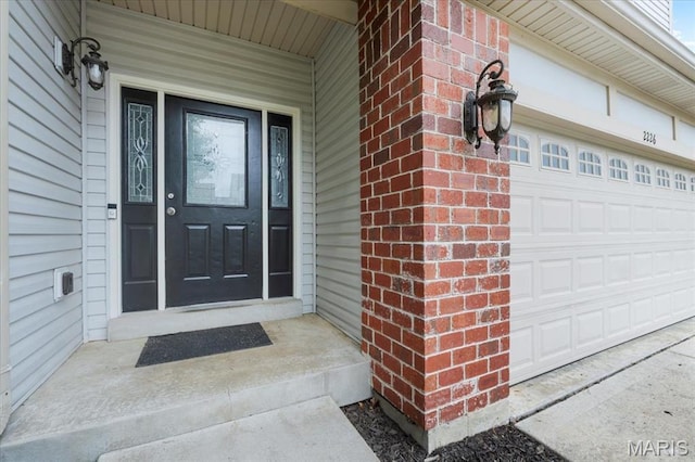 2226 Bay Tree Dr, Saint Peters, MO 63376 - doorway to property featuring brick siding and a garage