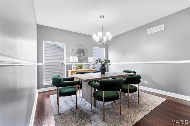 2226 Bay Tree Dr, Saint Peters, MO 63376 - dining space featuring a chandelier, wood finished floors, and baseboards