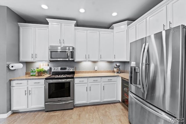 2226 Bay Tree Dr, Saint Peters, MO 63376 - kitchen featuring appliances with stainless steel finishes, white cabinetry, and recessed lighting