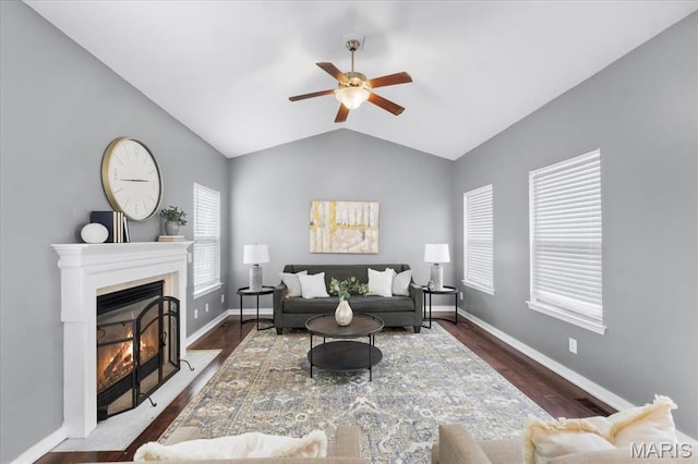 2226 Bay Tree Dr, Saint Peters, MO 63376 - living room with ceiling fan, a fireplace with flush hearth, lofted ceiling, wood finished floors, and baseboards