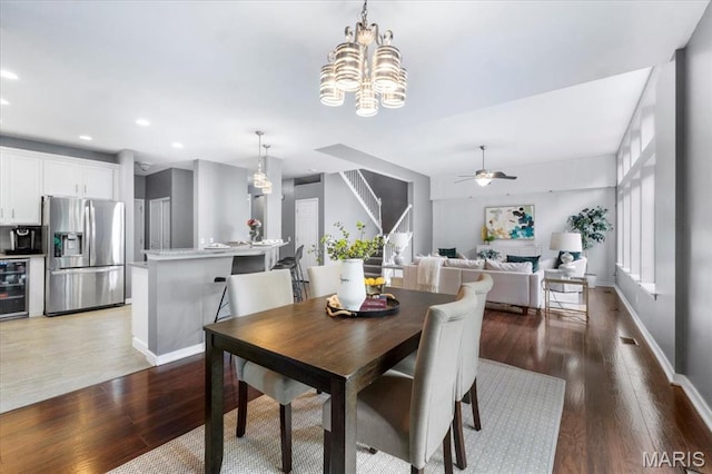 2226 Bay Tree Dr, Saint Peters, MO 63376 - dining space featuring wine cooler, wood finished floors, ceiling fan, recessed lighting, and a chandelier