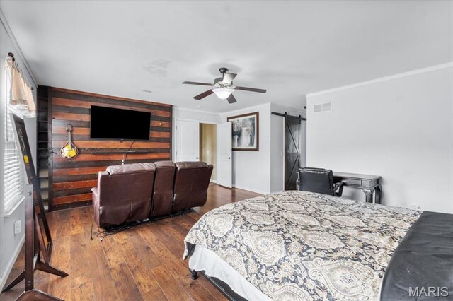 2226 Bay Tree Dr, Saint Peters, MO 63376 - bedroom with a barn door, crown molding, wood finished floors, and a ceiling fan