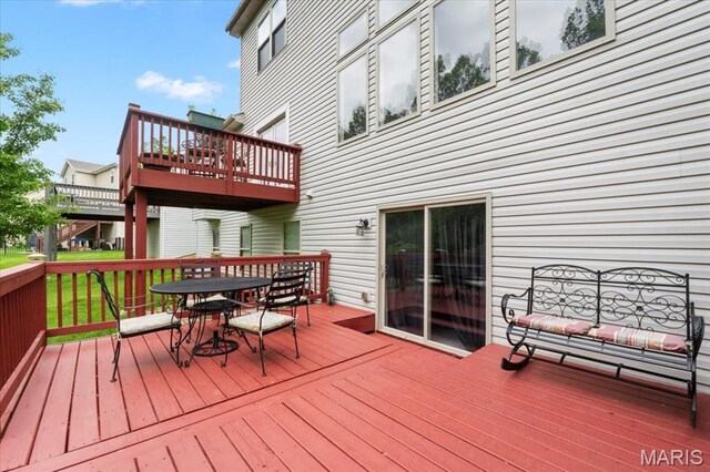 2226 Bay Tree Dr, Saint Peters, MO 63376 - wooden terrace featuring outdoor dining area