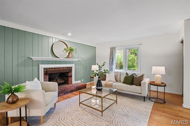2125 Crystal Dr, Saint Louis, MO 63131 - living area featuring wood finished floors, baseboards, a fireplace, and recessed lighting