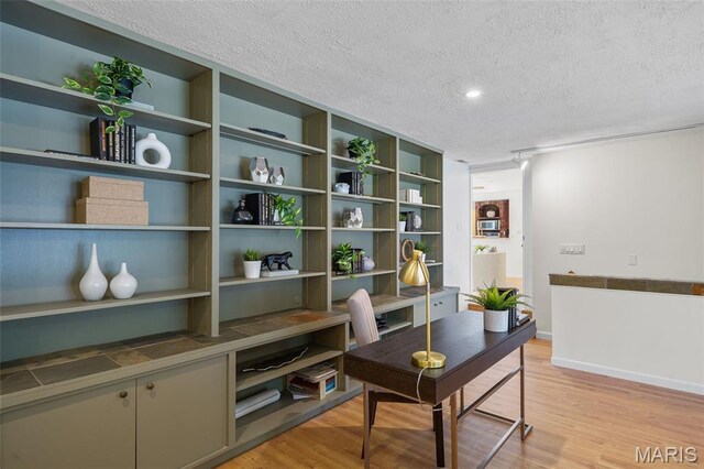 2125 Crystal Dr, Saint Louis, MO 63131 - office area with a textured ceiling, light wood-style floors, and baseboards