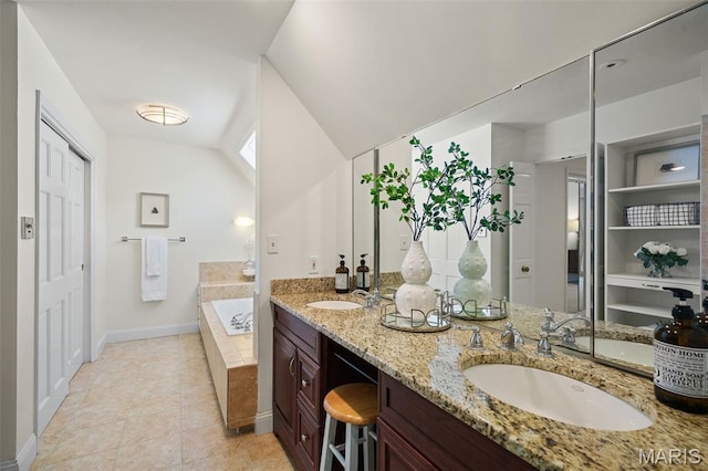2125 Crystal Dr, Saint Louis, MO 63131 - full bath featuring double vanity, a garden tub, baseboards, and tile patterned flooring