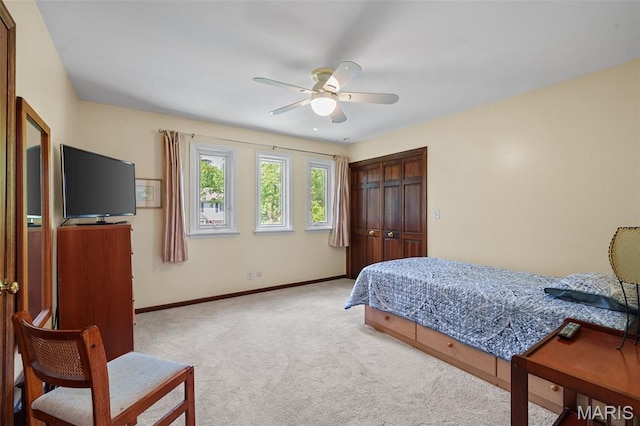 2125 Crystal Dr, Saint Louis, MO 63131 - carpeted bedroom featuring baseboards, a closet, and a ceiling fan