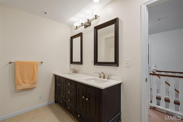 2125 Crystal Dr, Saint Louis, MO 63131 - full bath with double vanity, tile patterned flooring, and baseboards