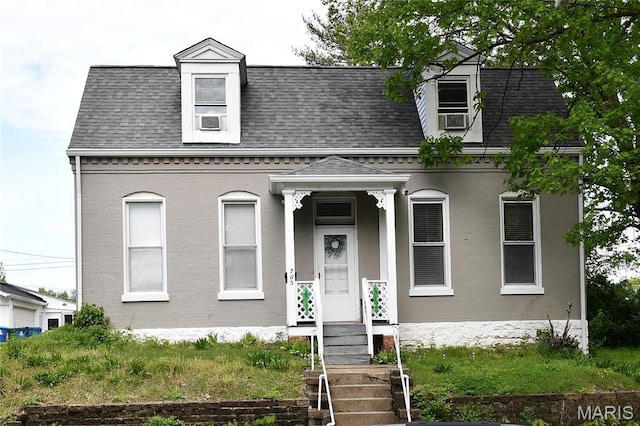 view of front of home featuring a shingled roof