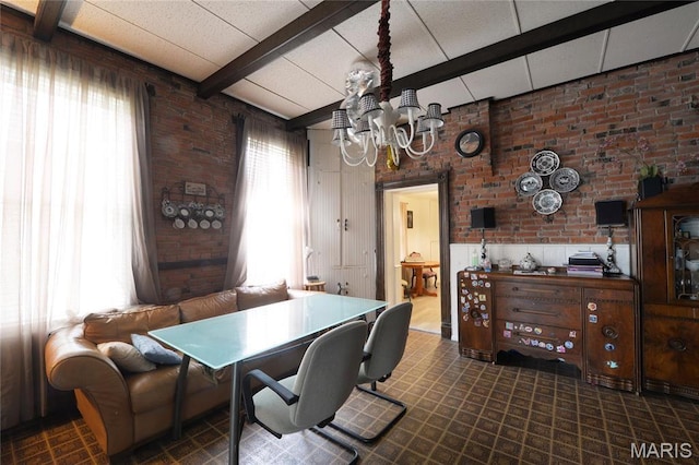 office space featuring beamed ceiling, brick wall, and a chandelier