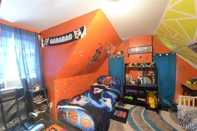 bedroom featuring lofted ceiling and carpet