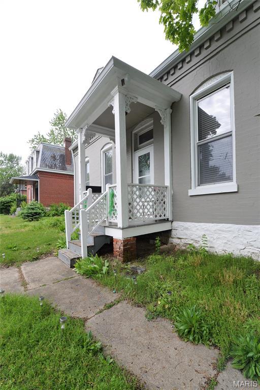 view of property exterior featuring a porch