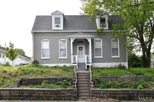 view of front of home featuring a shingled roof