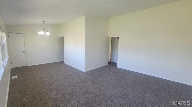 2490 Northridge Pl, Florissant, MO 63033 - unfurnished room with a chandelier, dark carpet, and baseboards