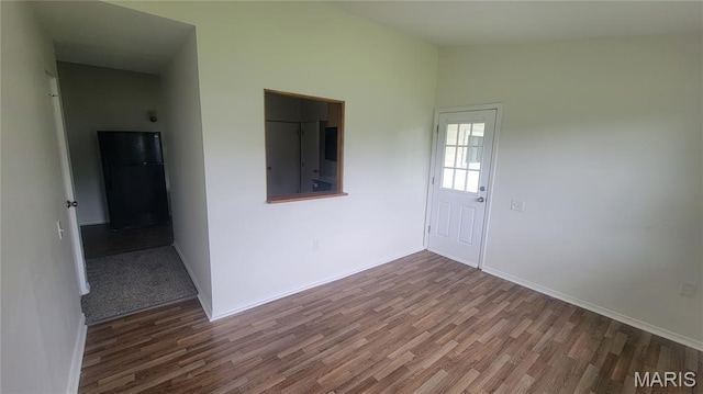 2490 Northridge Pl, Florissant, MO 63033 - entrance foyer featuring wood finished floors, baseboards, and vaulted ceiling