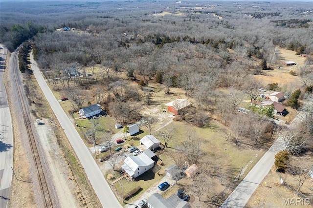 1909 W Springfield Rd, Saint Clair, MO 63077 - aerial view of property and surrounding area with a heavily wooded area