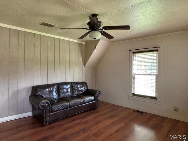 1909 W Springfield Rd, Saint Clair, MO 63077 - living room featuring a ceiling fan, wood finished floors, wood walls, baseboards, and crown molding