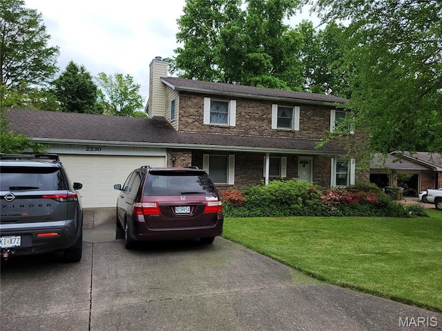 2230 Earleen St, Cape Girardeau, MO 63701 - traditional home featuring driveway, an attached garage, a chimney, a front yard, and brick siding