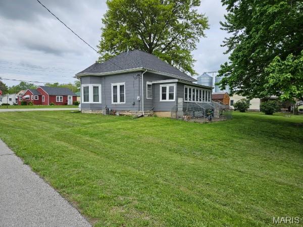 312 S Locust St, Monroe City, MO 63456 - back of house featuring a yard