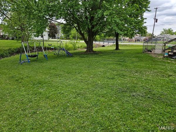 312 S Locust St, Monroe City, MO 63456 - view of grassy yard with a playground