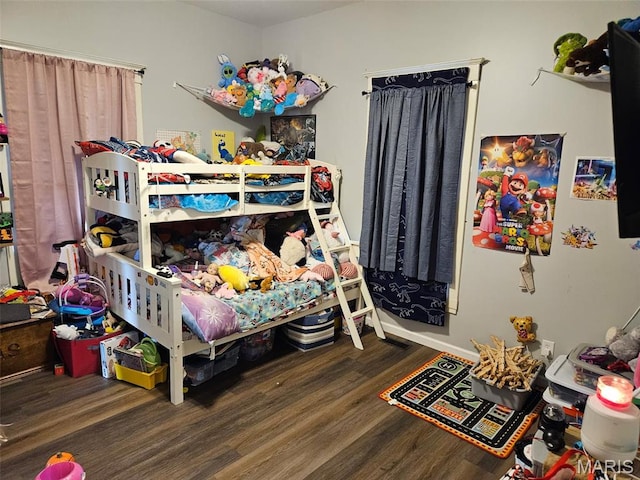 312 S Locust St, Monroe City, MO 63456 - bedroom featuring wood finished floors and baseboards