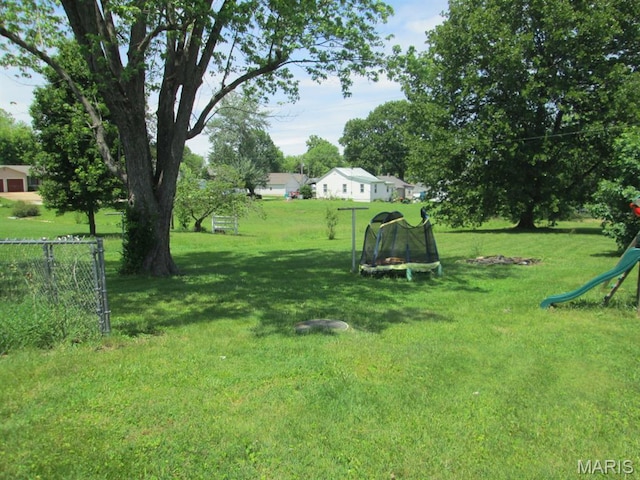 11 W S St, Gerald, MO 63037 - view of grassy yard featuring a trampoline