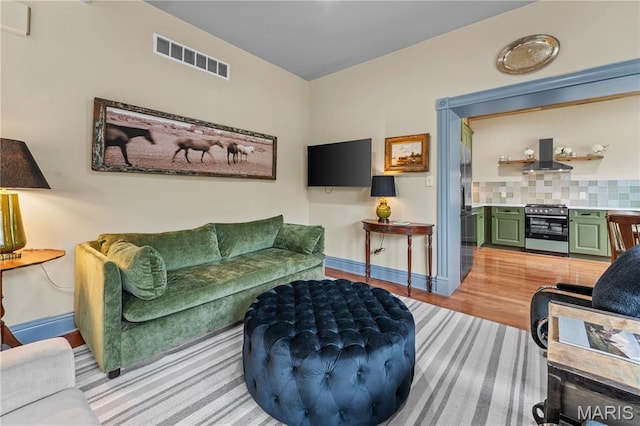3559 Halliday Ave Unit 102, Saint Louis, MO 63118 - living room featuring light wood-style flooring and baseboards