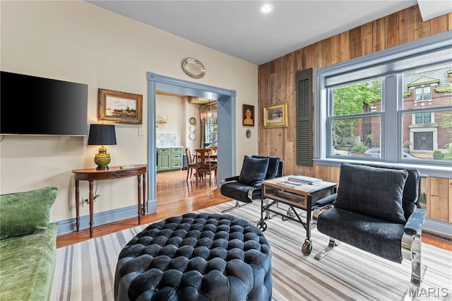 3559 Halliday Ave Unit 102, Saint Louis, MO 63118 - living area with wooden walls and wood finished floors