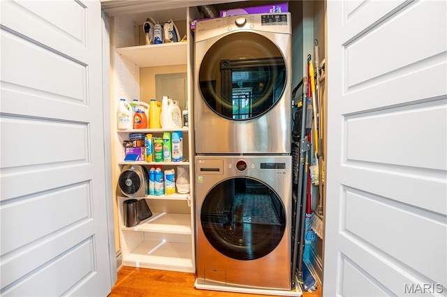 3559 Halliday Ave Unit 102, Saint Louis, MO 63118 - washroom featuring stacked washer / dryer and light wood-style floors