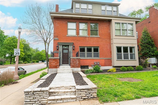 3559 Halliday Ave Unit 102, Saint Louis, MO 63118 - american foursquare style home featuring brick siding and a front lawn