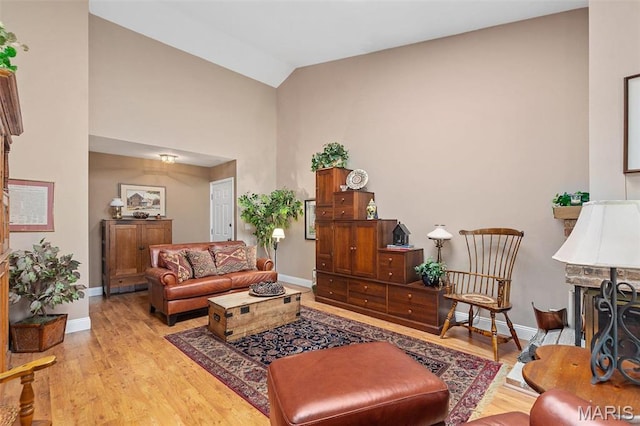 757 Windy Ridge Dr Unit B, Ballwin, MO 63021 - living area with light wood finished floors, baseboards, and high vaulted ceiling