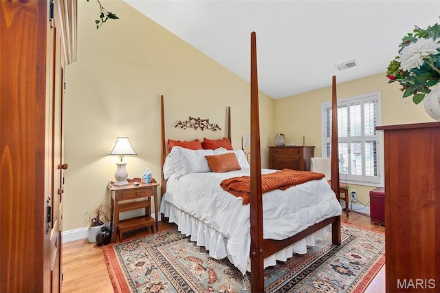 757 Windy Ridge Dr Unit B, Ballwin, MO 63021 - bedroom featuring light wood-style flooring, vaulted ceiling, and baseboards