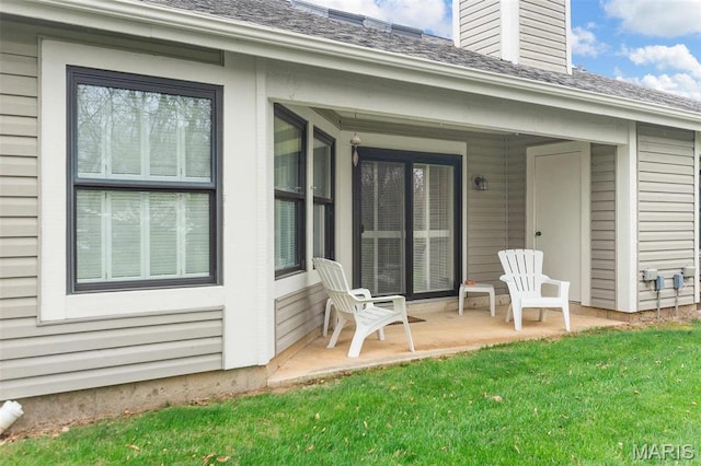 757 Windy Ridge Dr Unit B, Ballwin, MO 63021 - back of house featuring a chimney, a yard, a shingled roof, and a patio
