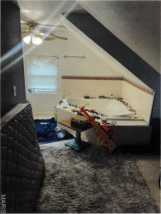 5 Gerri Ann Dr, Belleville, IL 62220 - bathroom featuring vaulted ceiling, a textured ceiling, a bath, a ceiling fan, and tile patterned floors