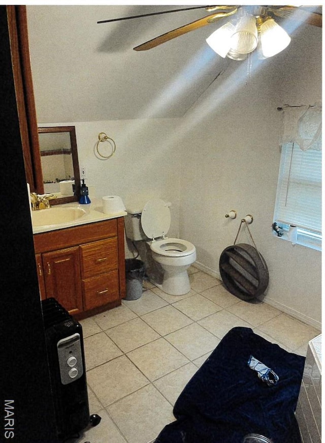 5 Gerri Ann Dr, Belleville, IL 62220 - bathroom featuring ceiling fan, tile patterned floors, vanity, vaulted ceiling, and toilet
