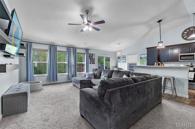 111 Hammond Dr, Herculaneum, MO 63048 - carpeted living area with plenty of natural light, a ceiling fan, and lofted ceiling