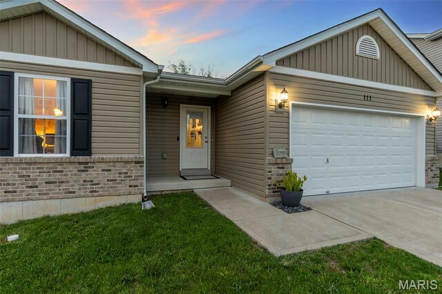 111 Hammond Dr, Herculaneum, MO 63048 - ranch-style house featuring brick siding, a garage, concrete driveway, and board and batten siding